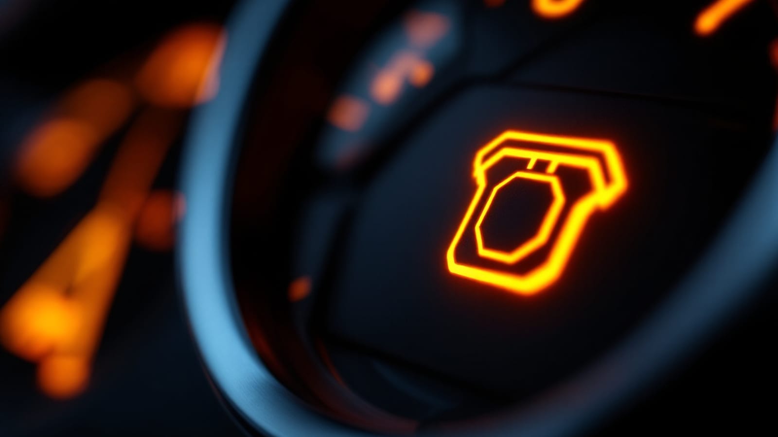 Amber engine-outline warning telltale glowing on an otherwise dark instrument cluster